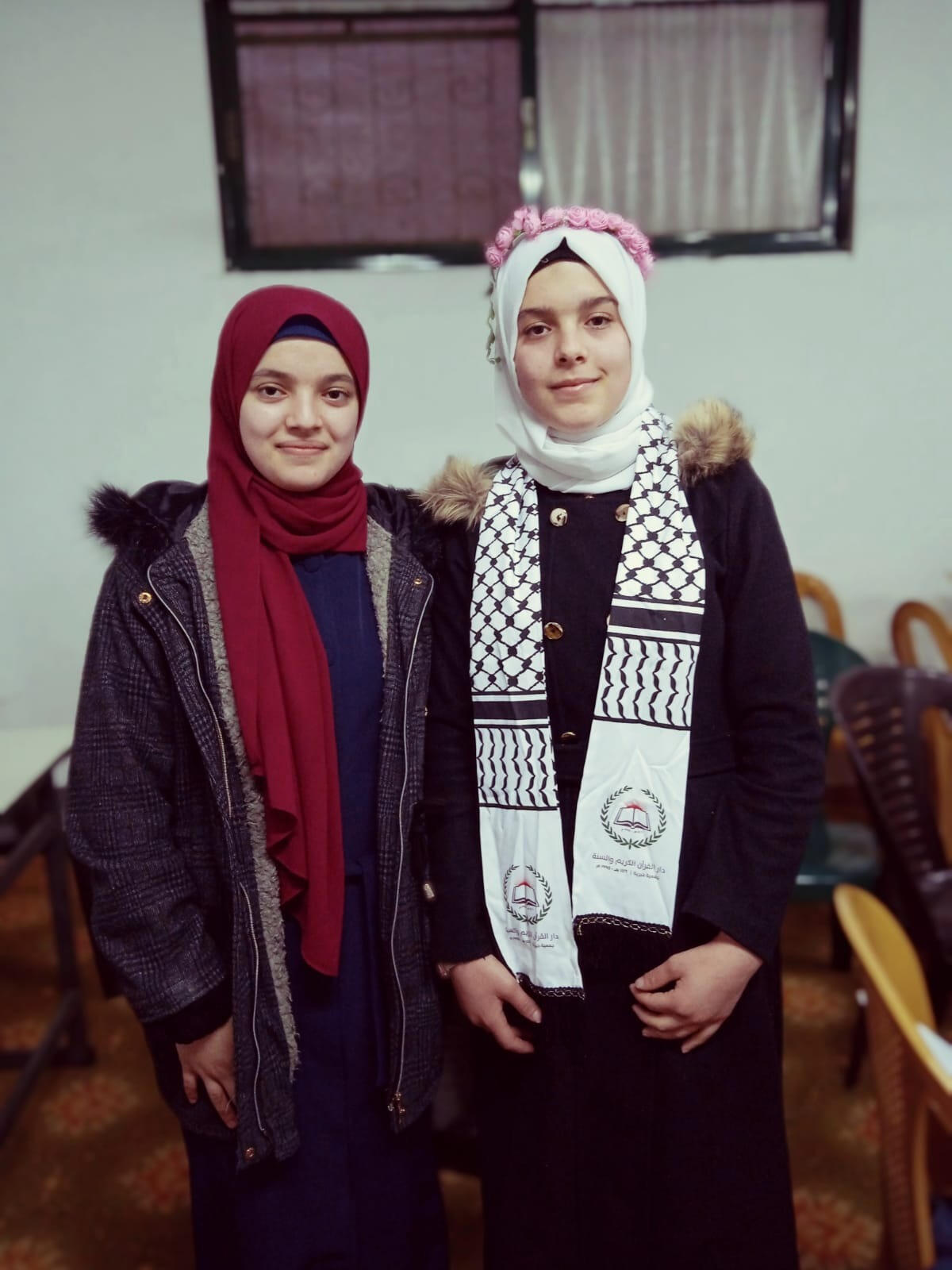 Hadeel, 18 years old, helps his siblings and Abdul Hadeel, 19 years old help his siblings and Abdul
